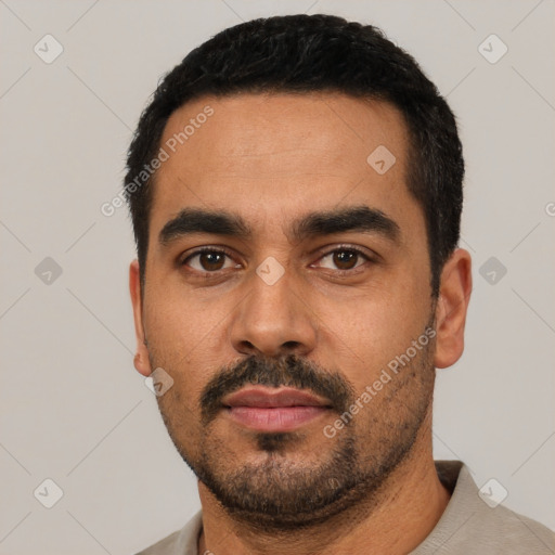 Neutral latino young-adult male with short  black hair and brown eyes