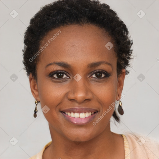 Joyful black young-adult female with short  brown hair and brown eyes