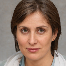 Joyful white adult female with medium  brown hair and brown eyes