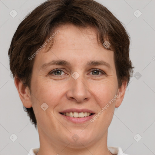 Joyful white adult female with short  brown hair and brown eyes