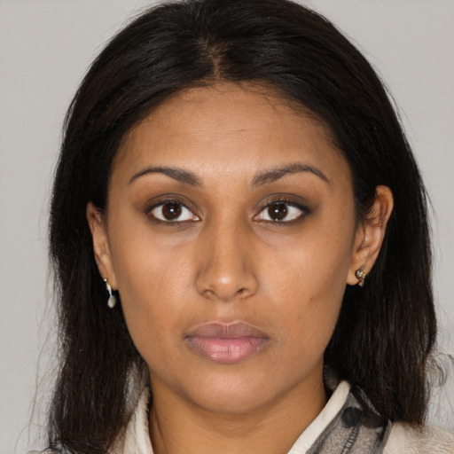 Neutral asian young-adult female with medium  brown hair and brown eyes