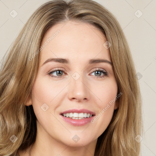 Joyful white young-adult female with long  brown hair and green eyes