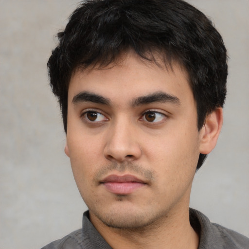Neutral white young-adult male with short  black hair and brown eyes
