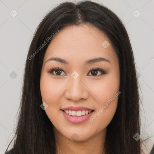 Joyful asian young-adult female with long  brown hair and brown eyes