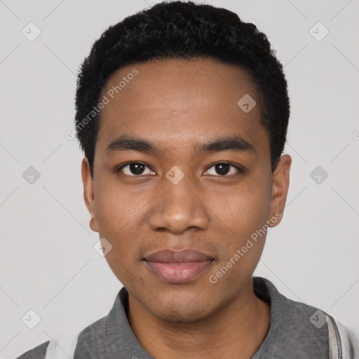 Joyful black young-adult male with short  black hair and brown eyes