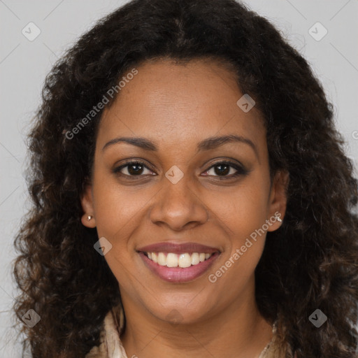 Joyful black young-adult female with long  brown hair and brown eyes