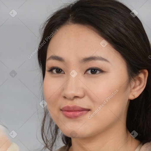 Joyful asian young-adult female with medium  brown hair and brown eyes