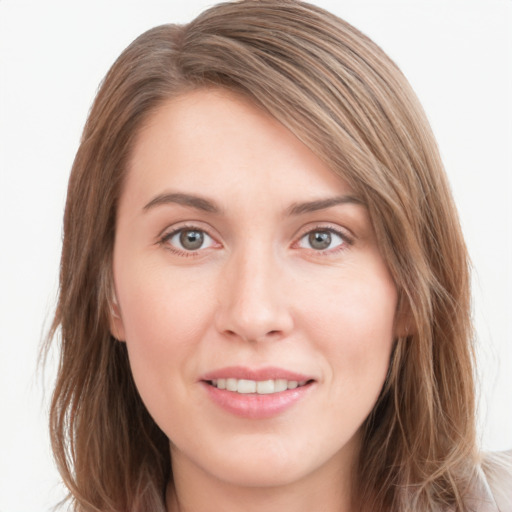 Joyful white young-adult female with long  brown hair and green eyes