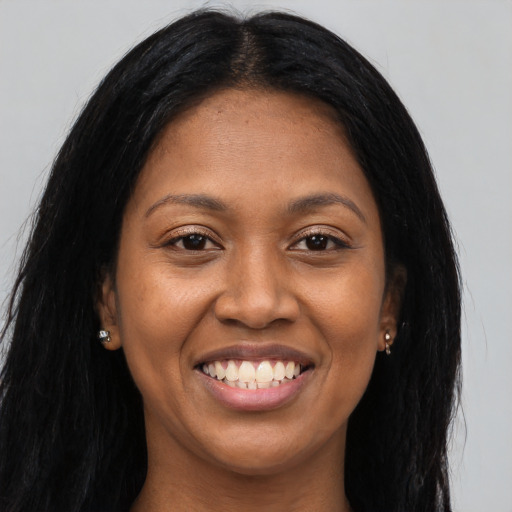 Joyful asian young-adult female with long  black hair and brown eyes