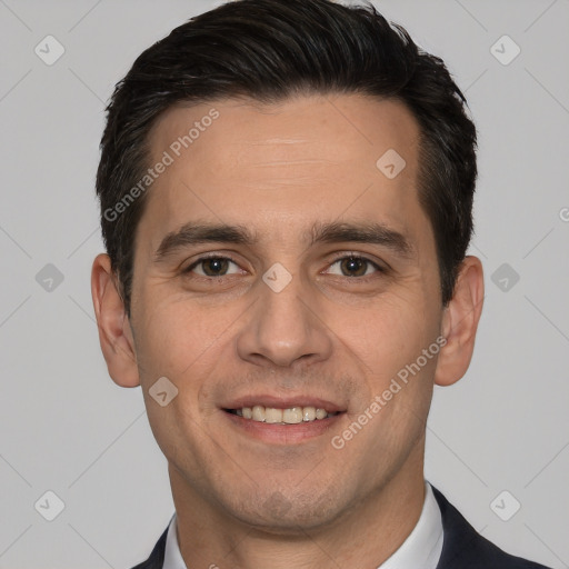 Joyful white young-adult male with short  black hair and brown eyes