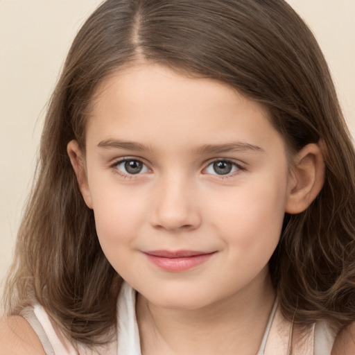 Joyful white child female with medium  brown hair and brown eyes