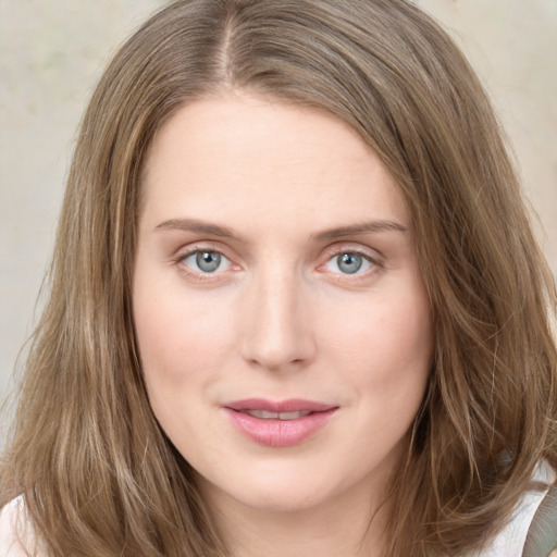 Joyful white young-adult female with long  brown hair and green eyes