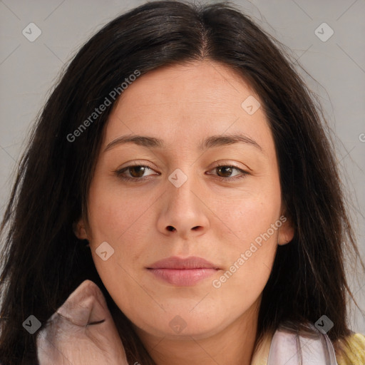 Joyful asian young-adult female with long  brown hair and brown eyes