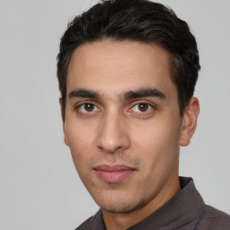 Neutral white young-adult male with short  black hair and brown eyes