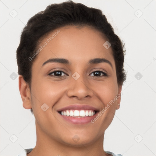 Joyful latino young-adult female with short  brown hair and brown eyes