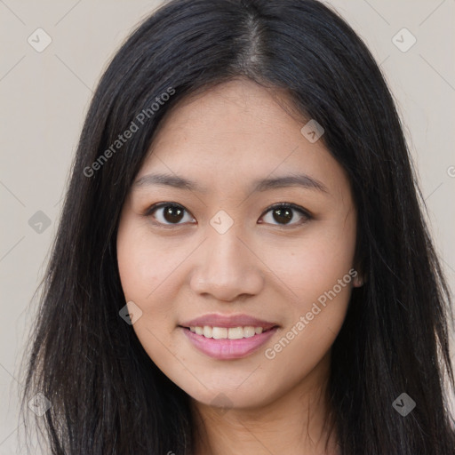 Joyful asian young-adult female with long  brown hair and brown eyes