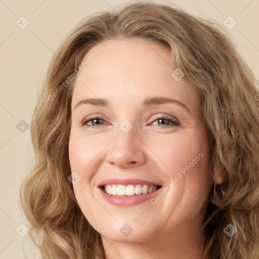 Joyful white young-adult female with long  brown hair and green eyes