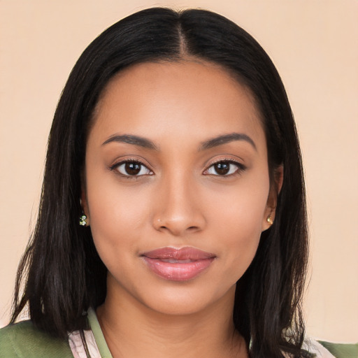 Joyful latino young-adult female with long  black hair and brown eyes