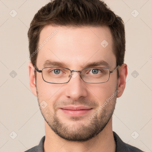 Joyful white young-adult male with short  brown hair and grey eyes