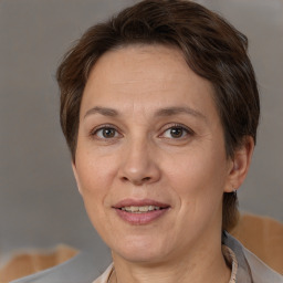 Joyful white adult female with short  brown hair and brown eyes