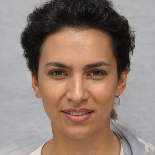 Joyful white young-adult female with short  brown hair and brown eyes
