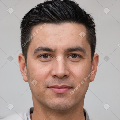 Joyful white young-adult male with short  black hair and brown eyes