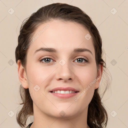 Joyful white young-adult female with long  brown hair and grey eyes