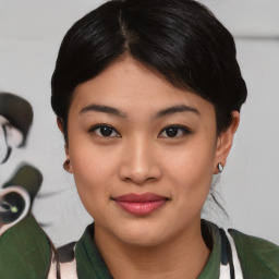 Joyful asian young-adult female with medium  brown hair and brown eyes