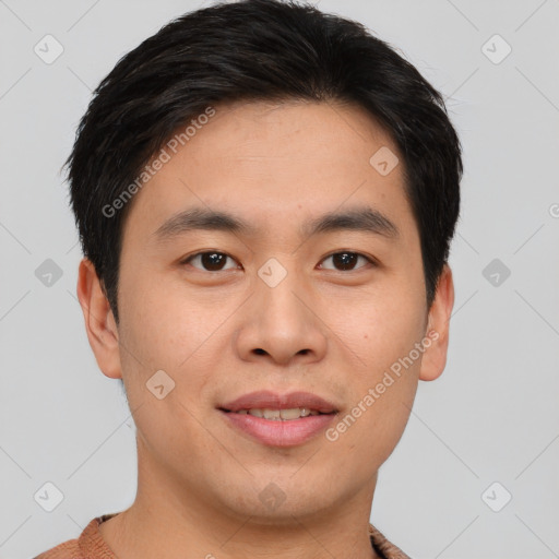 Joyful asian young-adult male with short  brown hair and brown eyes