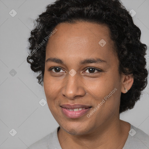 Joyful black adult female with short  brown hair and brown eyes