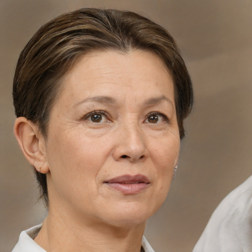 Joyful white adult female with medium  brown hair and brown eyes