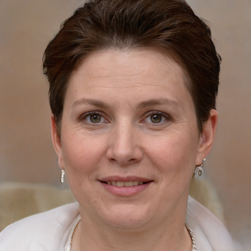 Joyful white adult female with short  brown hair and grey eyes