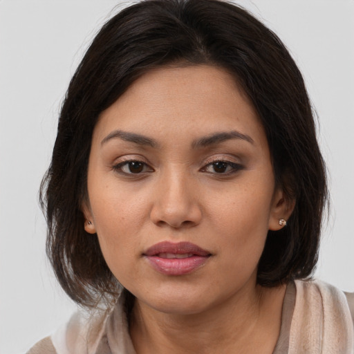 Joyful white young-adult female with medium  brown hair and brown eyes