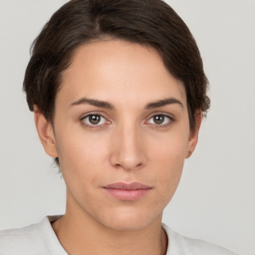 Neutral white young-adult female with short  brown hair and brown eyes