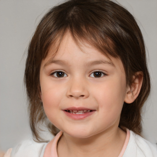 Joyful white child female with medium  brown hair and brown eyes