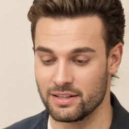 Joyful white adult male with short  brown hair and brown eyes