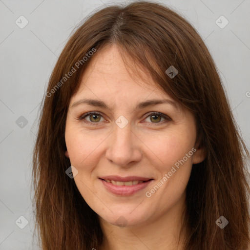 Joyful white adult female with long  brown hair and brown eyes