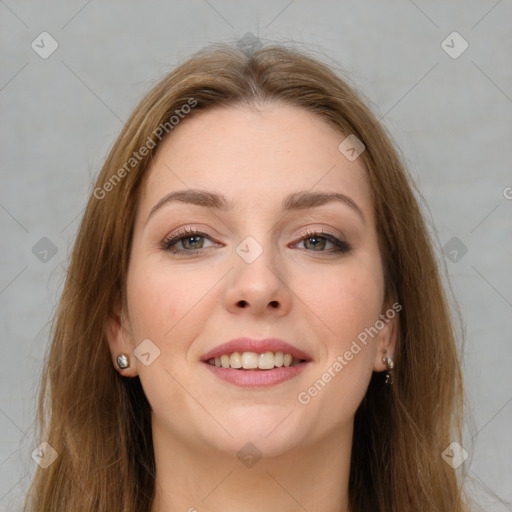 Joyful white young-adult female with long  brown hair and brown eyes