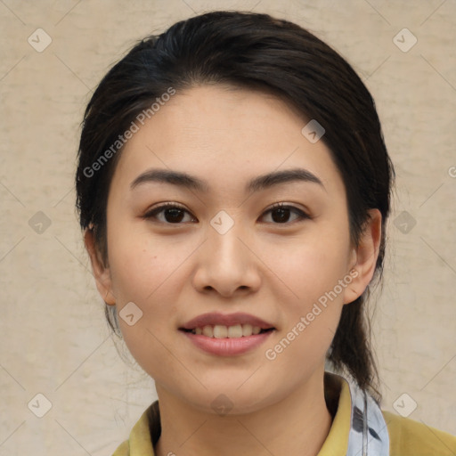 Joyful asian young-adult female with medium  black hair and brown eyes