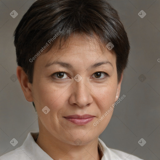 Joyful white adult female with short  brown hair and brown eyes