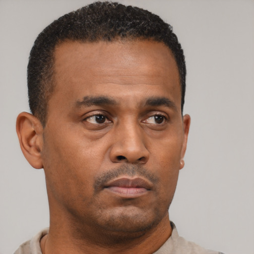 Neutral black young-adult male with short  brown hair and brown eyes