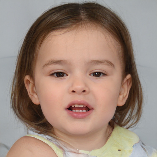 Joyful white child female with medium  brown hair and brown eyes