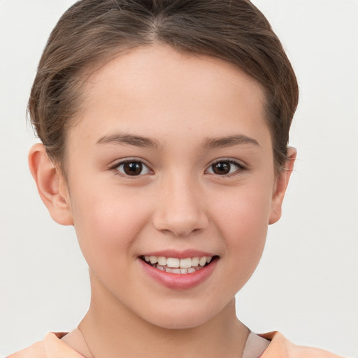 Joyful white child female with short  brown hair and brown eyes