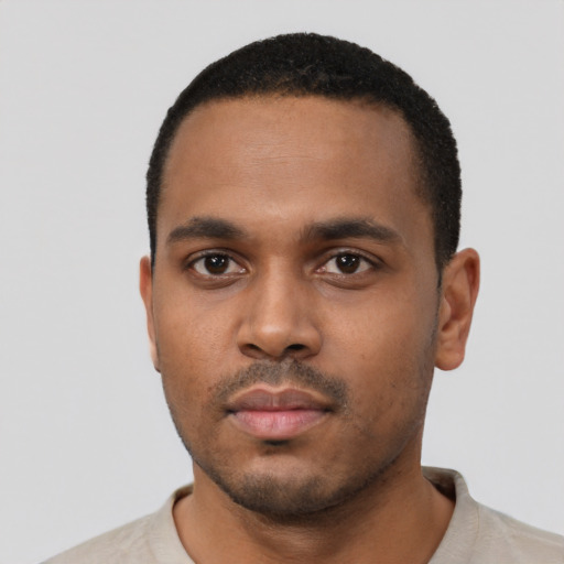 Neutral black young-adult male with short  black hair and brown eyes