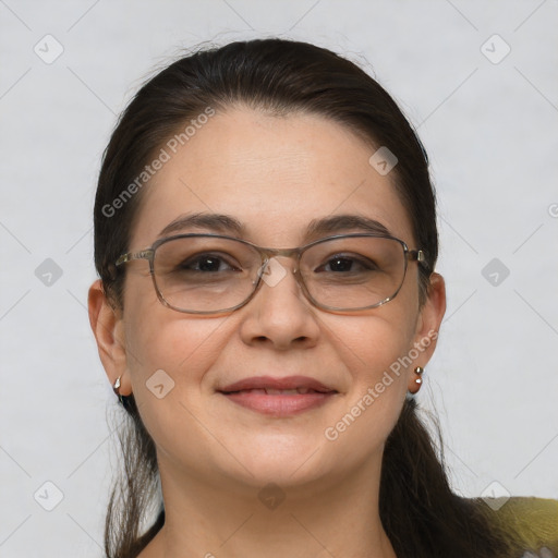 Joyful white adult female with medium  brown hair and brown eyes