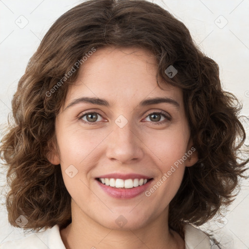 Joyful white young-adult female with medium  brown hair and green eyes