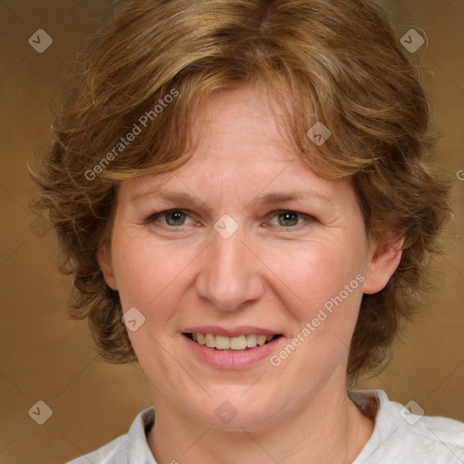 Joyful white adult female with medium  brown hair and green eyes