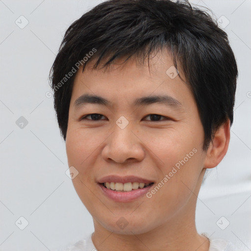 Joyful asian young-adult male with short  brown hair and brown eyes