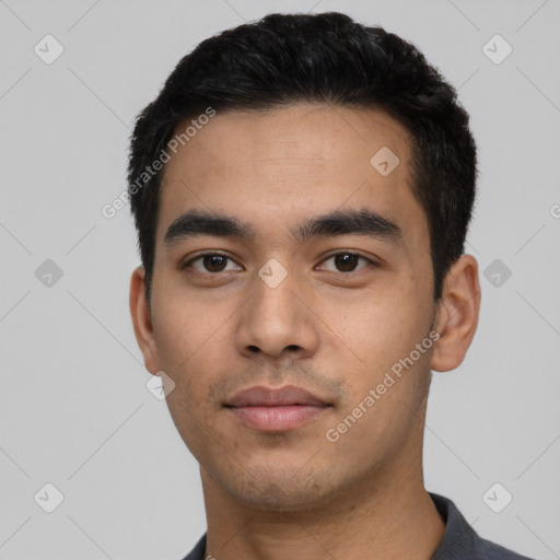 Neutral latino young-adult male with short  black hair and brown eyes