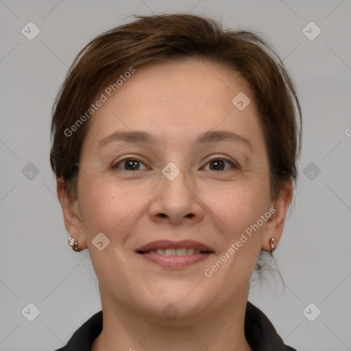 Joyful white adult female with medium  brown hair and grey eyes